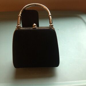 Small hard shell clutch